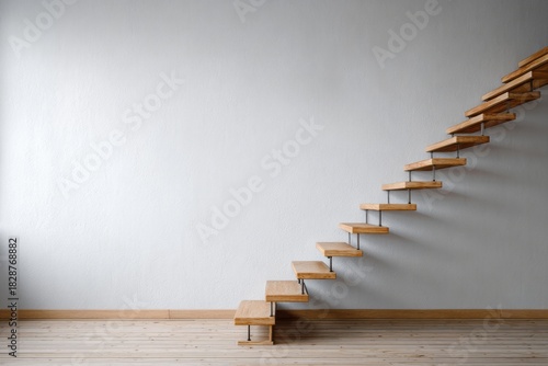 Modern floating wooden stairs ascend a minimalist wall.