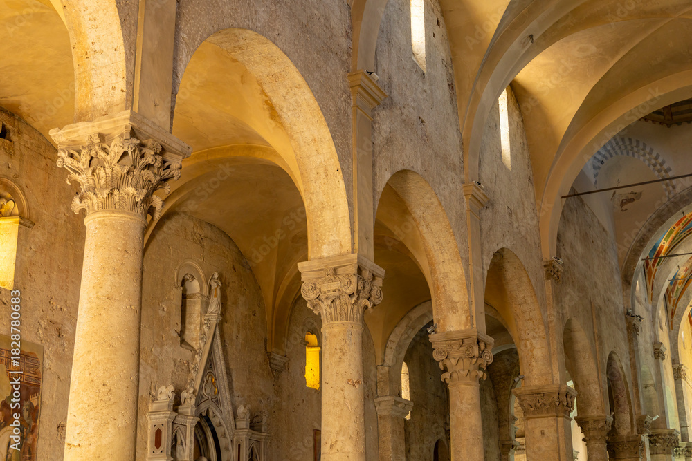 Naklejka premium Church interior with ancient arches and stone columns in Massa Marittima