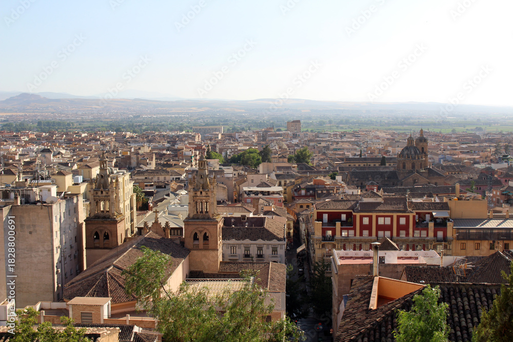 Fototapeta premium Hilltop view of Granada cathedral under renovation, photographed in July 2024.