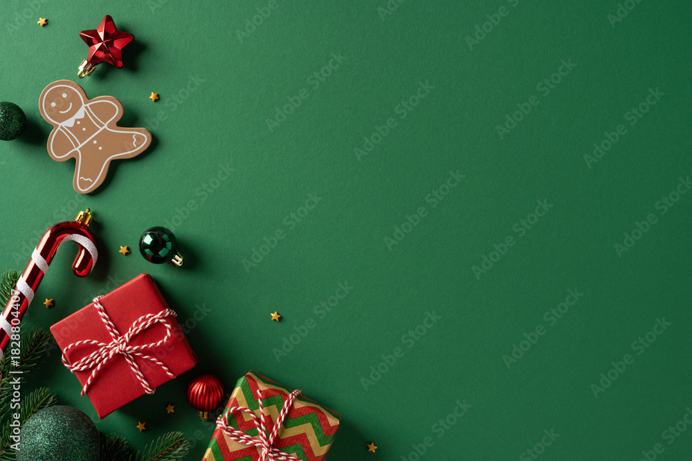 Obraz premium Festive Christmas scene with a gingerbread man, candy cane, and neatly wrapped gifts on a deep green background. Perfect for holiday, celebration, season, greeting, and seasonal gift ideas
