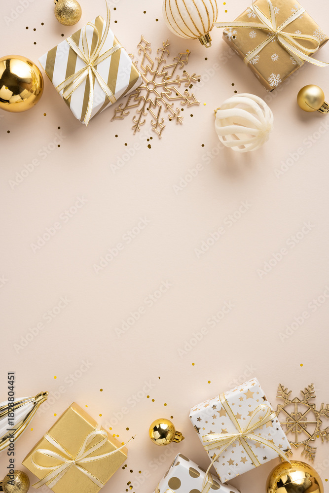Obraz premium Elegant vertical gold gifts, ornaments, and snowflake decor frame a warm Christmas and NewYear scene