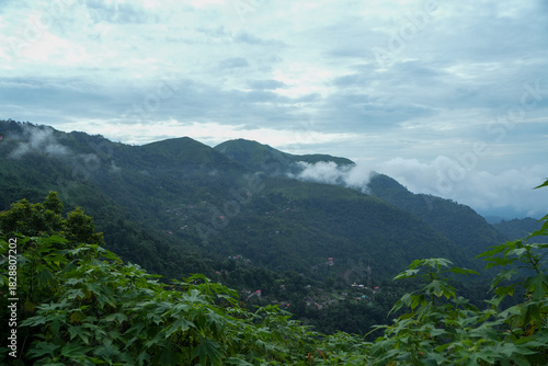 In the distance, mountains and clouds merge together.