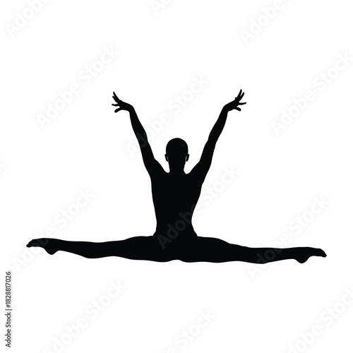 Silhouette of a dancer performing a split with arms raised in triumph