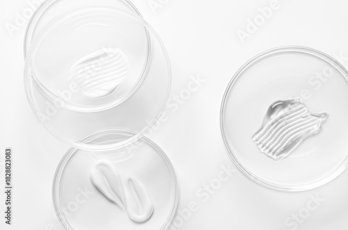 A sample of cosmetic moisturizing or anti-aging cream in a petri dish.