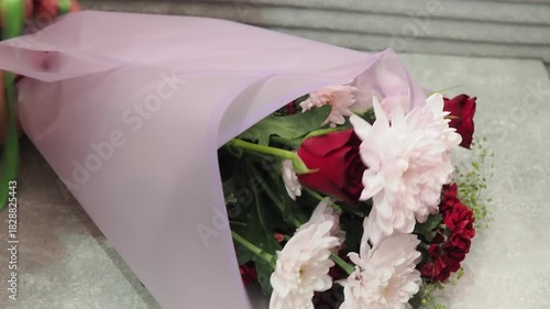 A flower bouquet is a beautifully and carefully arranged of flowers, typically used as a decoration or gift. A florist assembles a bouquet from various types of flowers. A gift is a life event.
