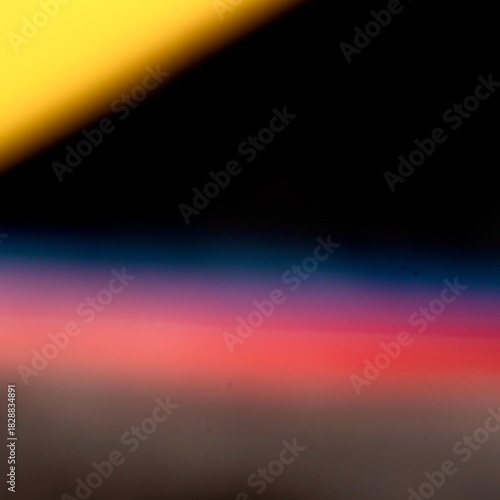 Abstract Light Leaks and Color Gradient on Black Background