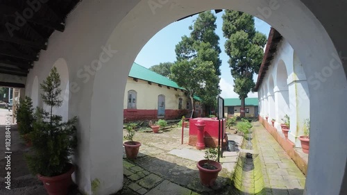 Exterior View of the White-Washed Arched Corridor or Gallery of the Dagshai Jail Museum, Highlighting the Repetitive Arches and Colonial Heritage Architecture in Himachal Pradesh