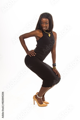 Confident Fashion Model Posing in Stylish Black Dress