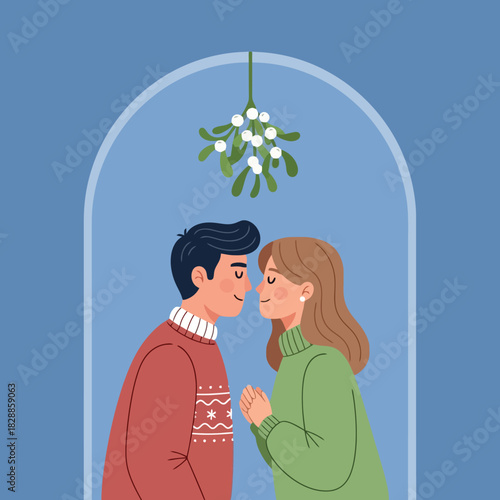 Romantic couple kissing under mistletoe during Christmas holiday season