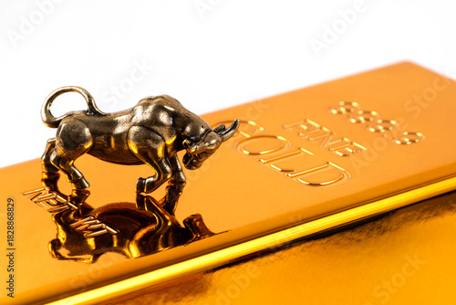 A conceptual story about investing in gold with a Golden Bull (Taurus) on a gold bar