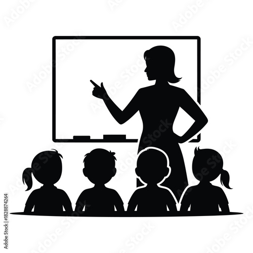 Silhouette of a female teacher pointing at a whiteboard while teaching a group of young student children