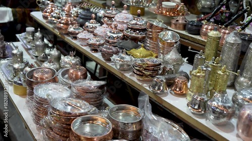Close up view of traditional turkish coffee pots, tea sets, ceramic pots in a shop.