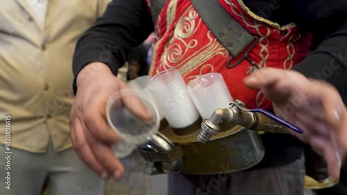 Traditional red licorice root syrup sale on the streets of Gaziantep, Turkey.