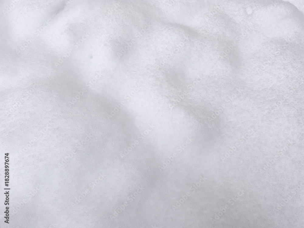Naklejka premium Winter texture. The surface of the snow. Winter background. A light backdrop. Top view.