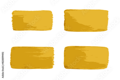 Collection of four textured golden yellow brush strokes isolated on a white background