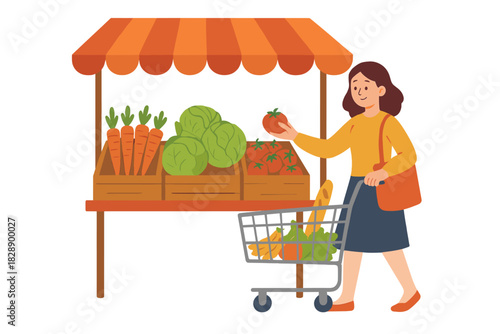 Female customer selecting fresh tomato from a street market stall with a shopping cart