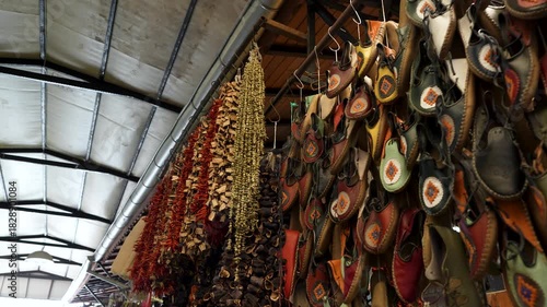 Handmade leather shoes, dried peppers and eggplants in a traditional bazaar in Turkey.