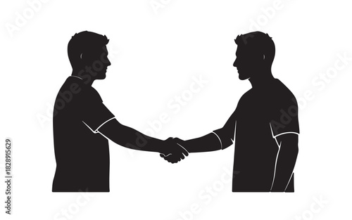 Silhouette of two men shaking hands in agreement or a sportsmanship gesture