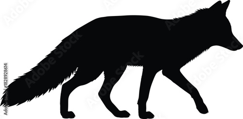 Silhouette of a walking fox in profile view with bushy tail and pointed ears for wildlife and design themes