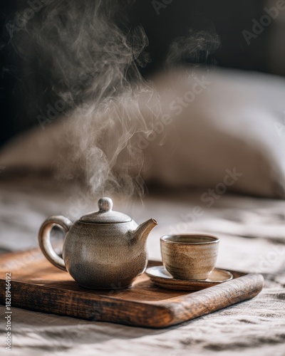 Steaming Rustic Teapot and Teacup on Wooden Tray, Warm Morning Light.