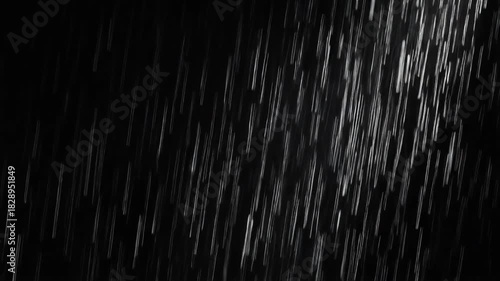 Dynamic motion blur of falling rain illuminated against a dark, pitch-black sky, perfect for overlays or backgrounds