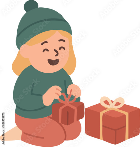 A cheerful little girl in a winter hat happily opens a wrapped gift, sitting beside another present during a cozy holiday moment.