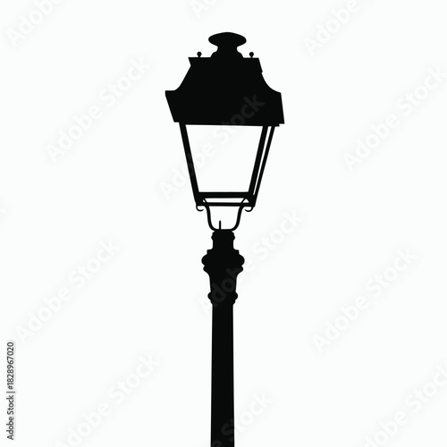 Black Silhouette of a Vintage Street Lamp Post with Ornate Top antique retro
