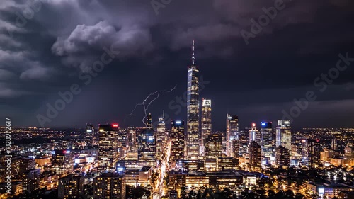 Wallpaper Mural Experience the dynamic energy of the city at night with stunning skyline views and dramatic storm clouds rolling across the horizon Torontodigital.ca