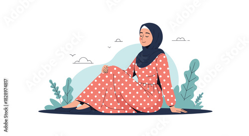 Peaceful Muslim woman in a polka dot dress and hijab relaxing outdoors while sitting on the grass with eyes closed.