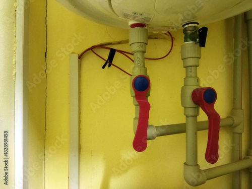 Water heater valves and piping setup in a residential area