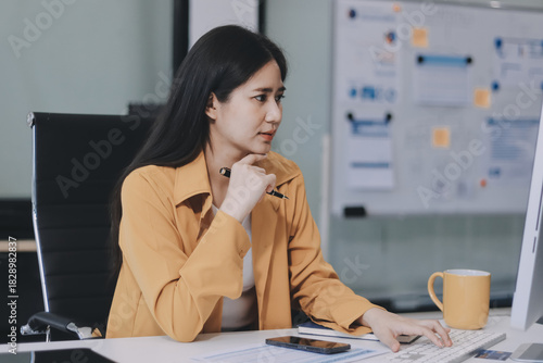 Business woman using calculator for do math finance on wooden desk in office and business working background, tax, accounting, statistics and analytic research concept.