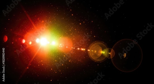 Lens flare effect with red, green, and yellow lights on a black background