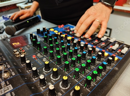 DJ's hands at the console