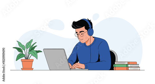 A young man with glasses and headphones smiling while studying or working on a laptop at his desk with books and a plant.