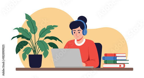 A young woman with headphones concentrating on her work or studies on a laptop at a cozy home office desk with books and a plant.