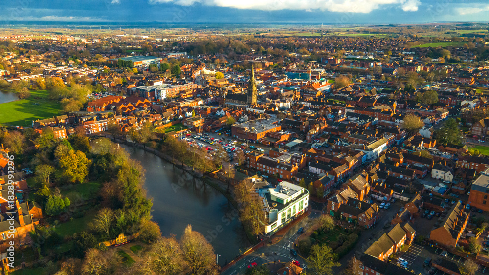 Fototapeta premium River Sowe flowing through Lichfield city core with central spire visible