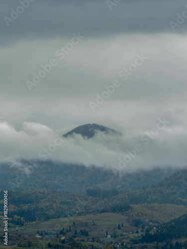 Misty Autumn Rain Clouds over Ukrainian Carpathian Mountains.