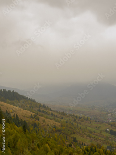 Misty Autumn Rain Clouds over Ukrainian Carpathian Mountains.