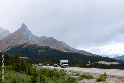 Camper driving through the Rocky Mountain landscape on the Icefield Parkway in Canada