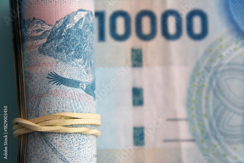 Financial concept with ten thousand Chilean peso banknotes