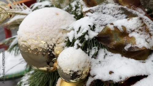 Snow Covered Christmas Ornaments And Pine Branches Video