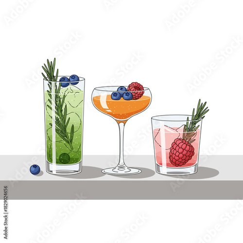 Stylish cocktails with berries and herbs on gray shelf background
