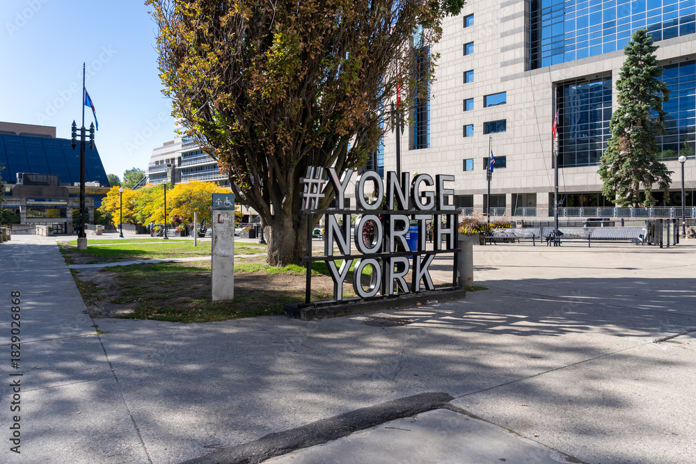 Naklejka premium Toronto, Canada - September 28, 2025: # YONGE NORTH YORK ground sign at Lastman Square in Toronto, Canada. North York is a former city and is now one of the six administrative districts of Toronto. 