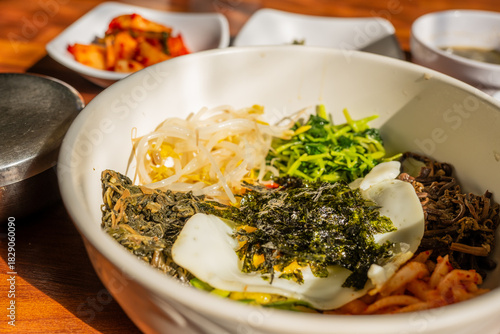 Korean Bibimbap Bowl with Fresh Vegetables and Seaweed