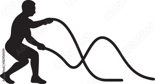 Man performing intense battle rope exercise for fitness training