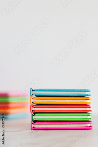 colourful children books on minimalist setup, concept of learning to read and early education