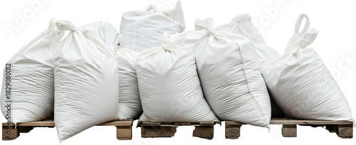 A collection of large white sacks filled with material and tied shut resting on wooden pallets bags bulk storage cargo delivery