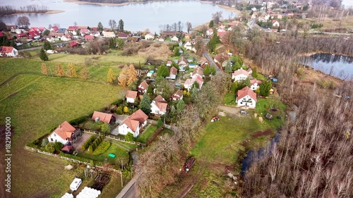 Aerial Zełwagi Poland farm village lake 2. Farming fishing town, tourist destination in lake district. First building of The Church of Jesus Christ of Latter-day Saints in central Europe.