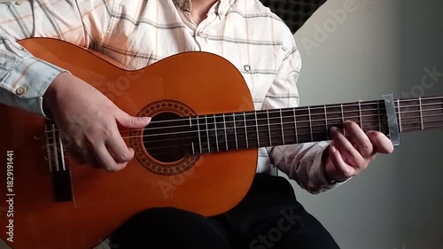 man playing acoustic guitar