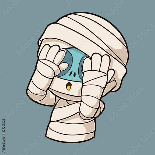 A cute cartoon mummy peeks out with blue eyes wide